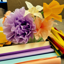 Purple and orange tissue paper flowers.